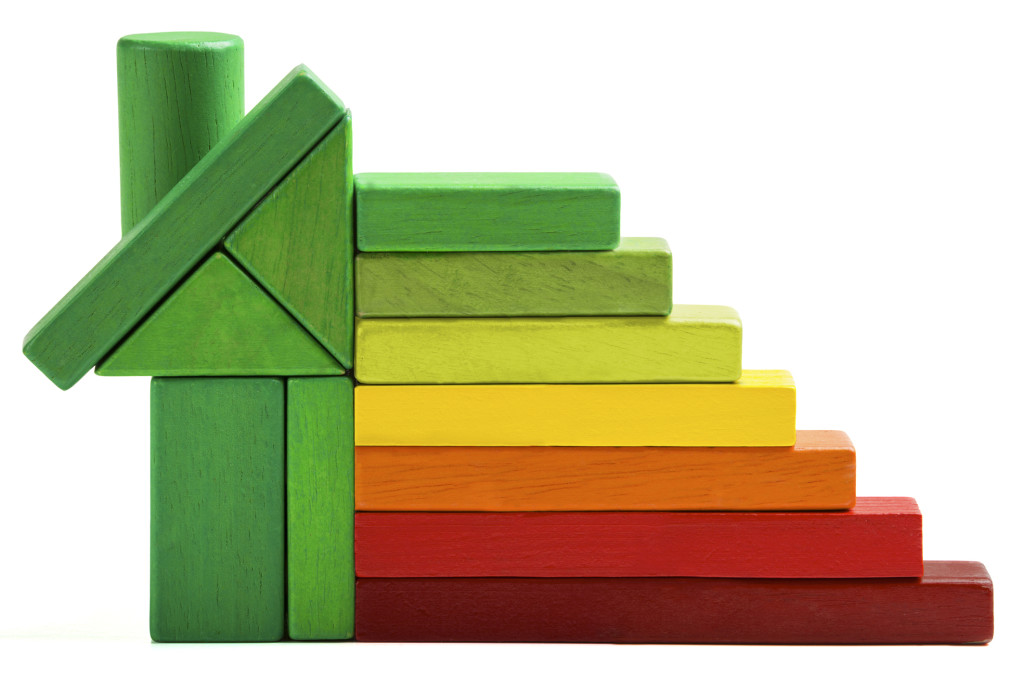 house energy efficiency rating, green home save heat and ecology. Toy blocks isolated white background